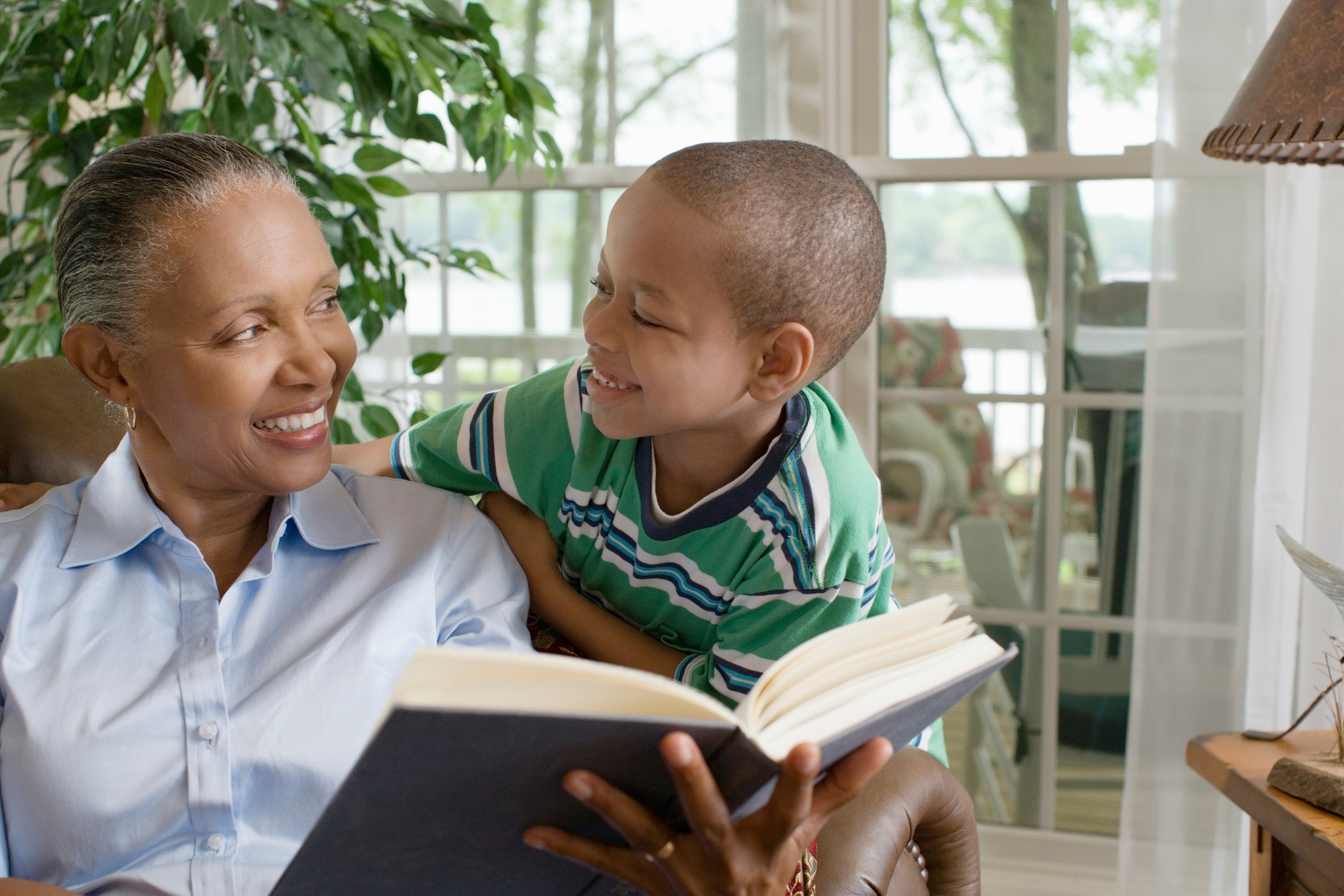 Grandmother and grandson enjoying a story together