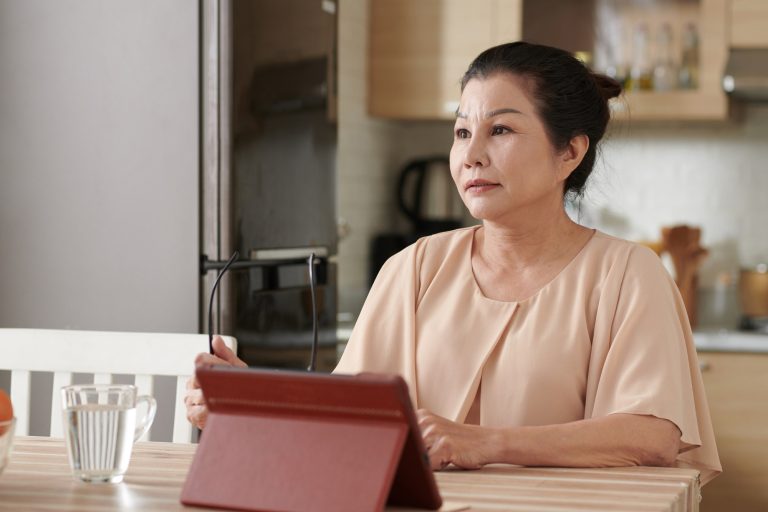 Senior Woman Working on Tablet