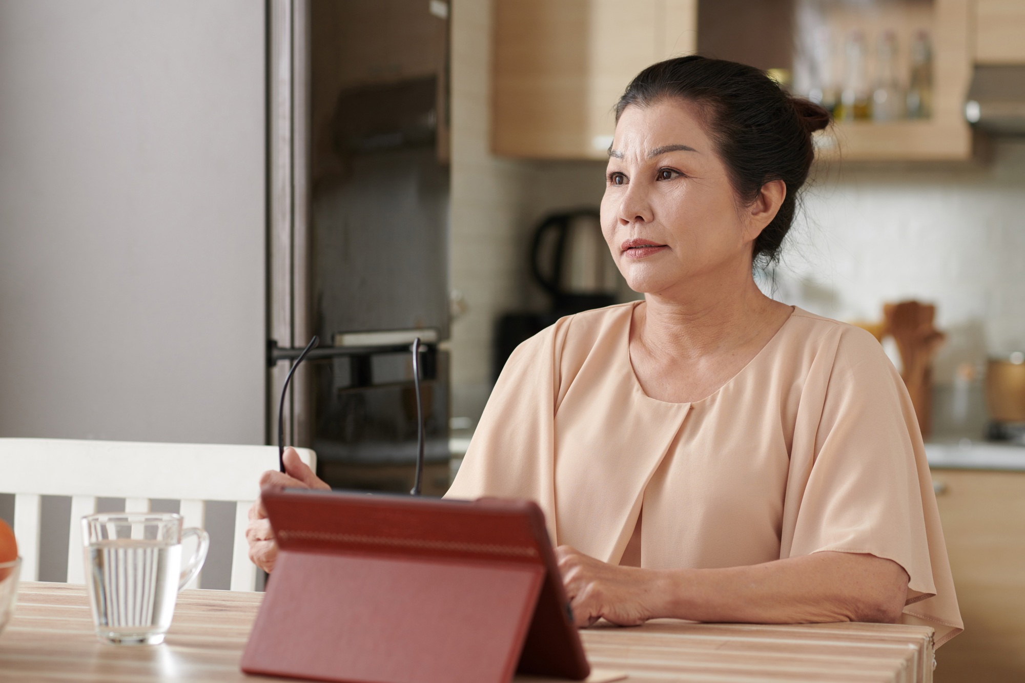 Senior Woman Working on Tablet